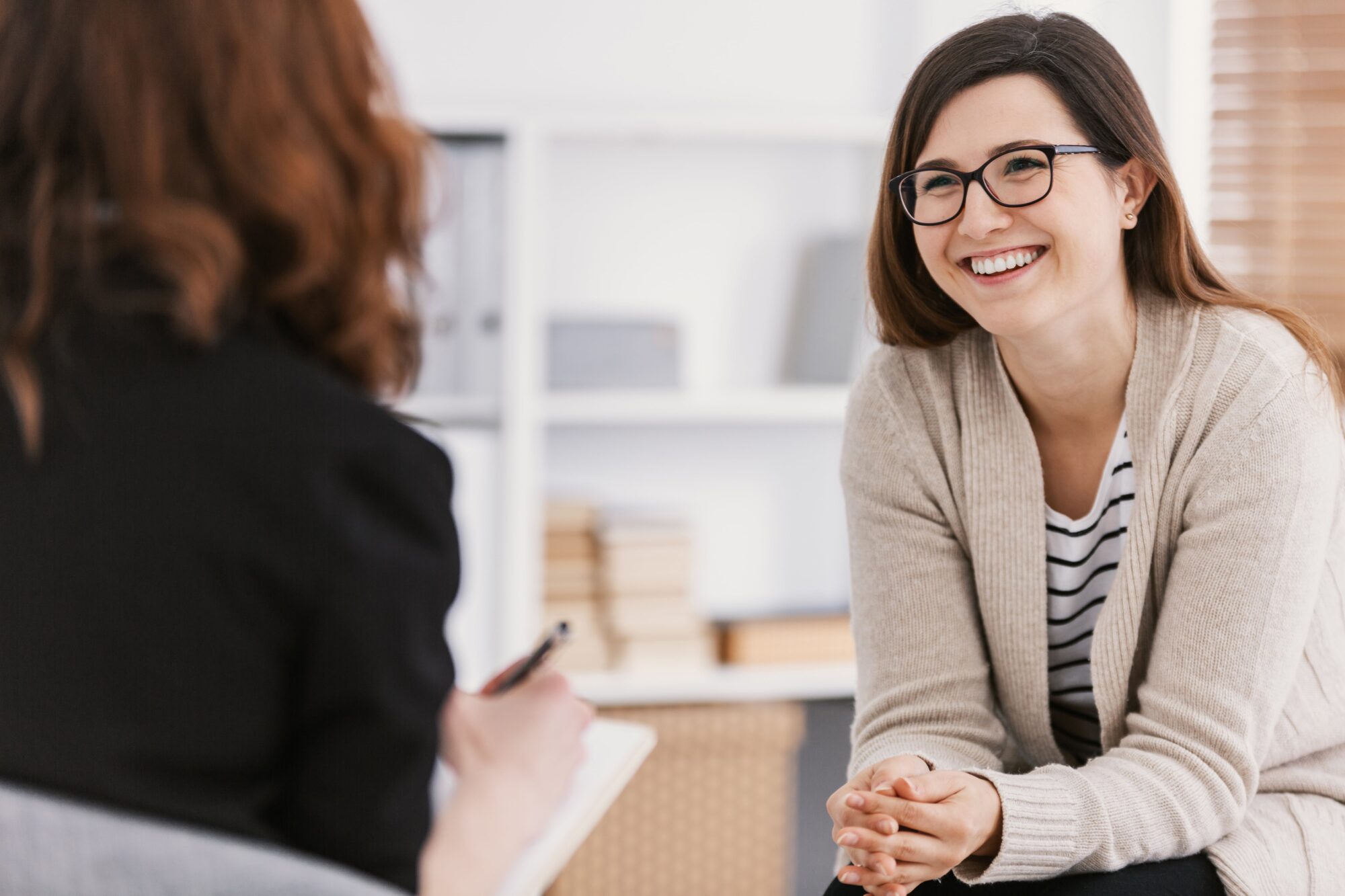 Woman smiling talking to counselor
